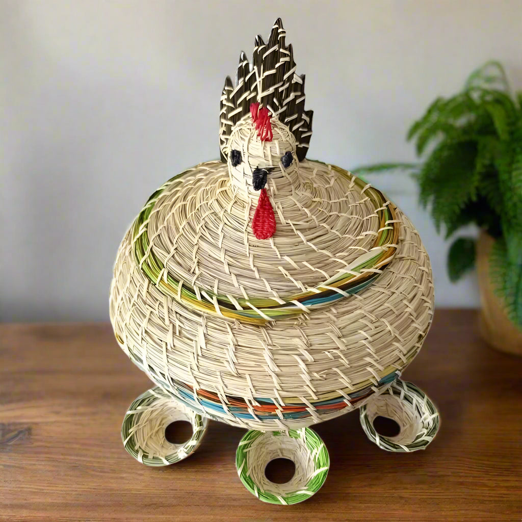 Hand Made Chicken Shaped Egg Basket on a table with a green pot plant behind